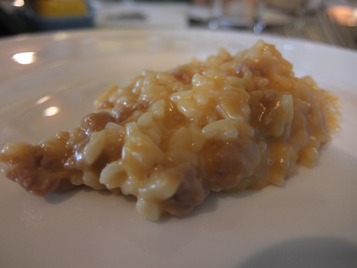 Risotto crema di zucca, provola e sgranato di salsiccia